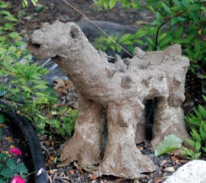This guy was my first attempt at a standing hypertufa. His back will be filled with soil and planted up. I left his eyes and mouth open so that I can plant plants inside of them.